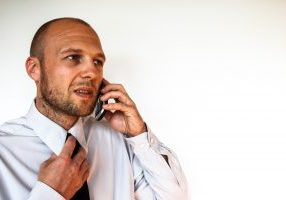 stop creditor harassment - phone on phone looking upset